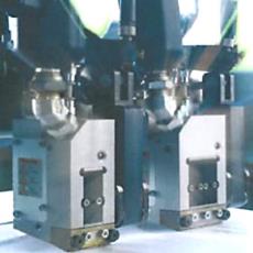 Coating Heads With Manual Or Motor Driven Adjustment